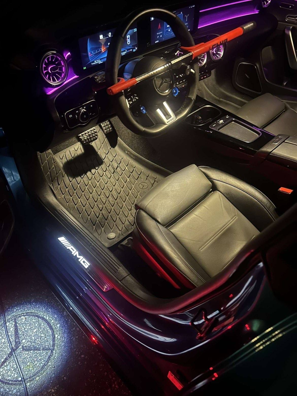 The same footwell, mat and driver’s seat after the detail, lit at night