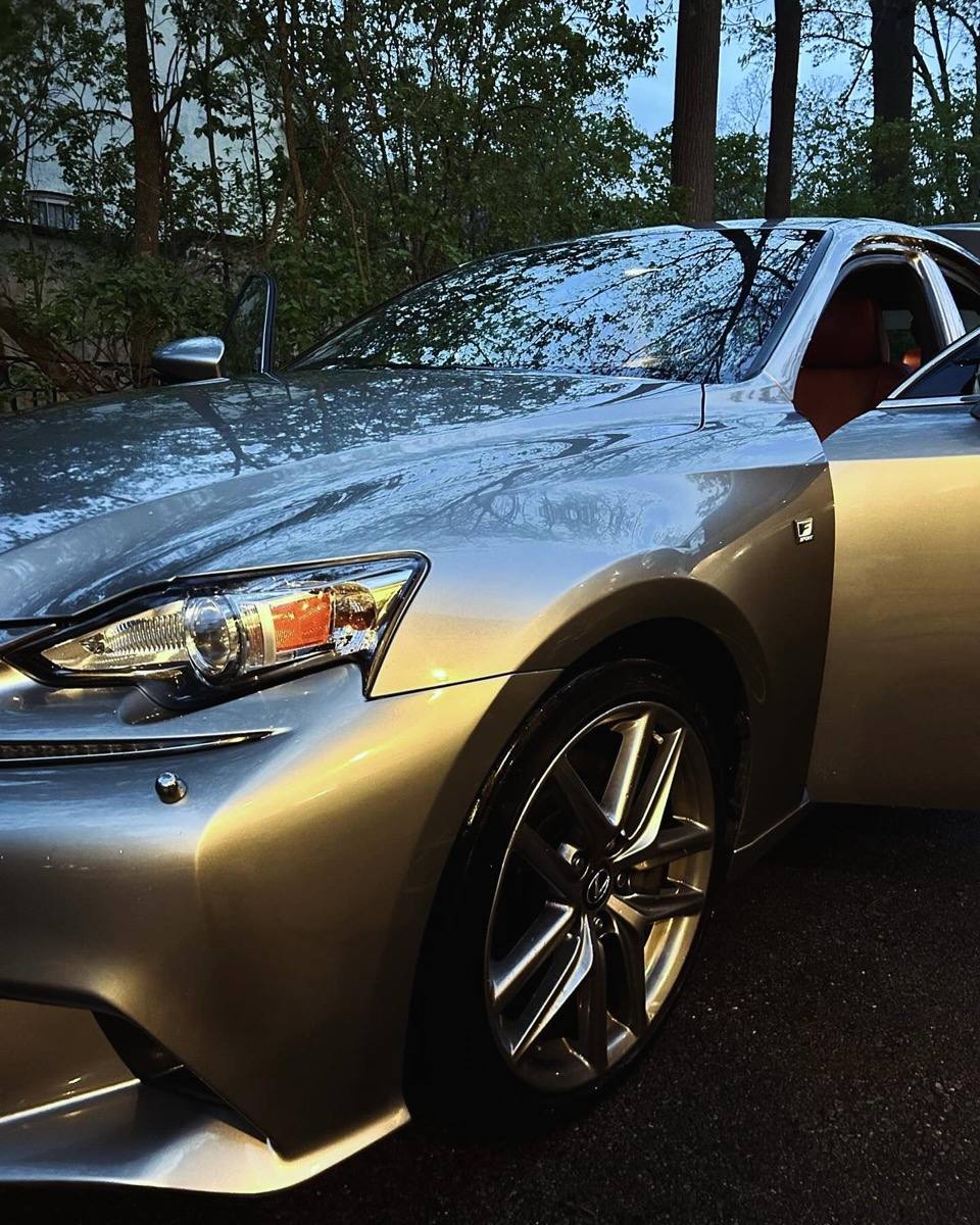 Silver Lexus IS front fender and wheel after a full detail