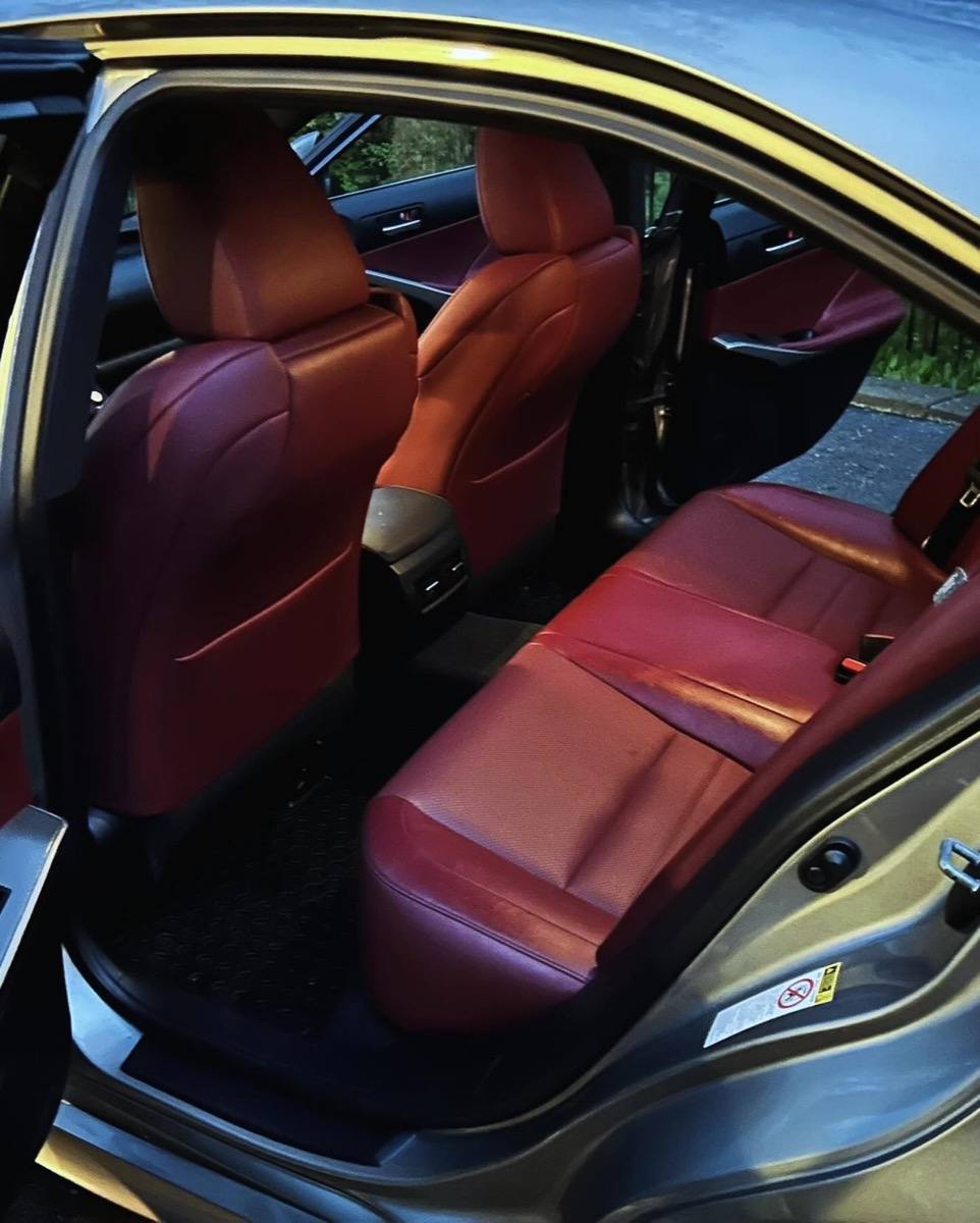 Red leather rear seats of the same Lexus after the detail